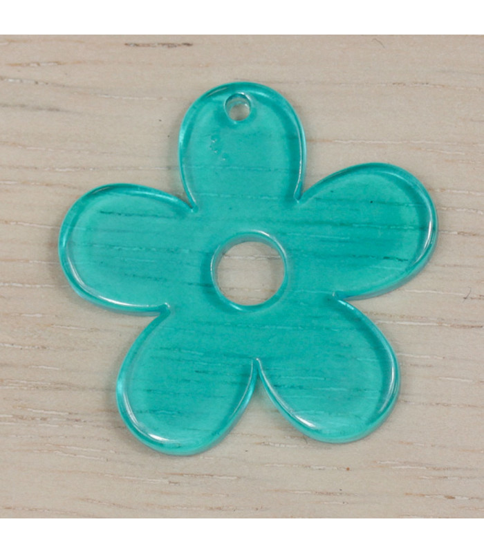 Pendentif Fleur Evidée en acrylique bleu turquoise transparent